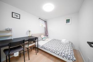 Postel nebo postele na pokoji v ubytování 温馨小屋Aa