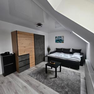 a bedroom with a bed and a staircase at Sonia in Bragadiru