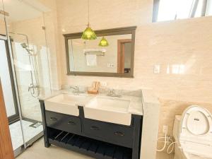 a bathroom with a sink and a mirror at Gió Hotel in Huế in Hue