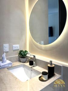 a bathroom with a sink and a large mirror at Peregrina Tulum 301A 2BR Luxury Condo in Tulum