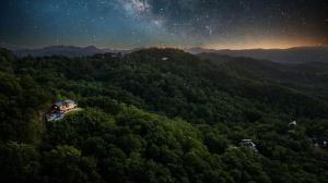 an aerial view of a forest at night at Honey Bear Hideaways - Luxury Cabin with Infinity Pool, Breathtaking Mountain Views & Sunset Decks in Sevierville