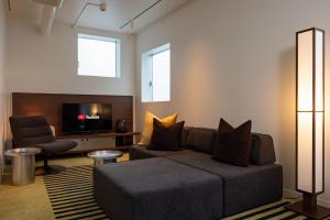 a living room with a couch and a tv at JAPAVISTA r4 in Tokyo +36 photos