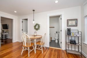 a dining room with a table and chairs at Historic Ludlow Apt B in Ludlow