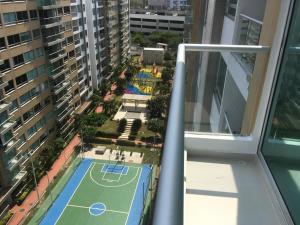 a view of a tennis court from a balcony at Confortable Apartamento in Barranquilla +9 photos