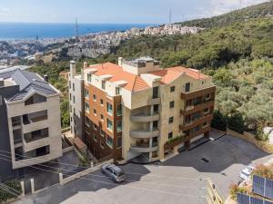 an aerial view of a building at 2BR Sunset Over Ain Saade in Beit Meri