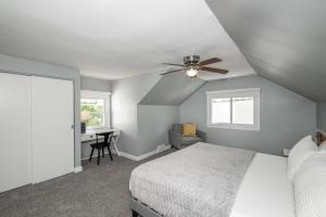 a bedroom with a bed and a ceiling fan at Love 'n Life Haven in Cincinnati +12 photos