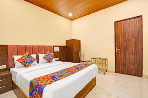 a bedroom with a large bed in a room at Via Surya Grand in Mumbai +17 photos