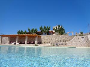 a view from the water of a swimming pool at Porto Panorama in Porto Heli