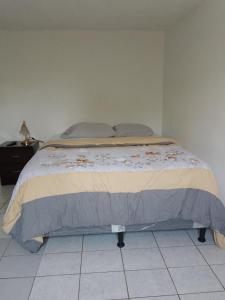 Postel nebo postele na pokoji v ubytování Cobán room