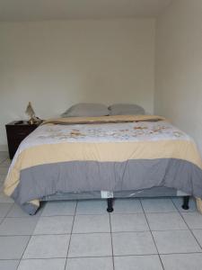 Postel nebo postele na pokoji v ubytování Cobán room