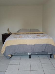 Postel nebo postele na pokoji v ubytování Cobán room