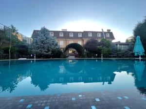a large pool of water in front of a building at HL 309 Hotel in Tashkent