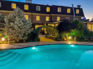 a large swimming pool in front of a building at HL 309 Hotel in Tashkent +41 photos