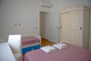 Postel nebo postele na pokoji v ubytování Rosa Dei Venti