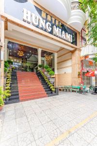 a store front with a red carpet in front at HÙNG MIAMI HOTEl - 3 SAO in Ho Chi Minh City