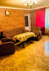 a living room with two couches and a table at Cozy corner Dilijan in Dilijan