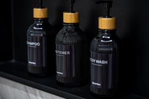 a group of three bottles sitting on a shelf at Spacious 4BR, Pool, Jacuzzi, Pickleball, Sauna, Cold Plunge in Desert Hot Springs