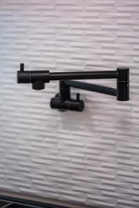 a black object is hanging on a wall at Spacious 4BR, Pool, Jacuzzi, Pickleball, Sauna, Cold Plunge in Desert Hot Springs