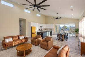 a living room with a couch and chairs and a table at Spacious 4BR, Pool, Jacuzzi, Pickleball, Sauna, Cold Plunge in Desert Hot Springs