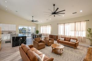 a living room with couches and a kitchen at Spacious 4BR, Pool, Jacuzzi, Pickleball, Sauna, Cold Plunge in Desert Hot Springs
