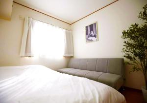 Postel nebo postele na pokoji v ubytování 東京都葛飾区の貸切一軒家
