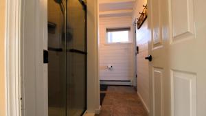 a hallway with a glass door and a window at Sunset Retreat in North Cape May +32 photos