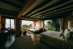 Postelja oz. postelje v sobi nastanitve Dwarika's Himalayan Wellbeing, Dhulikhel