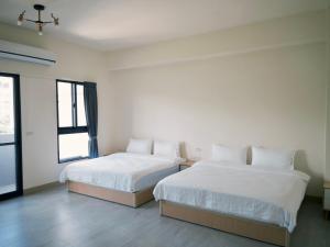 Katil atau katil-katil dalam bilik di 瑞穗阿牛的家 Rui Sui Moo Guesthouse
