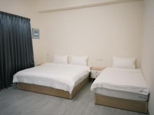 Katil atau katil-katil dalam bilik di 瑞穗阿牛的家 Rui Sui Moo Guesthouse