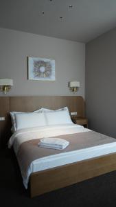 Primavera Hotel客房内的一张或多张床位