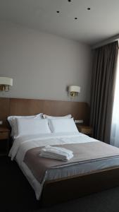 Primavera Hotel客房内的一张或多张床位