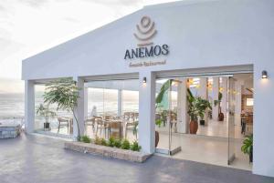 A restaurant or other place to eat at Ramada Loutraki Poseidon Resort
