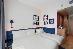 Postel nebo postele na pokoji v ubytování Hampton By Hilton Venice Isola Nuova