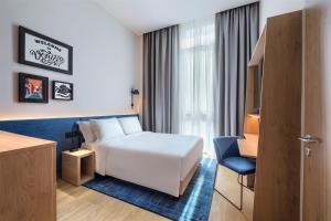 Postel nebo postele na pokoji v ubytování Hampton By Hilton Venice Isola Nuova
