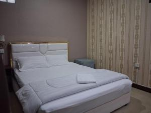 Postel nebo postele na pokoji v ubytování Twilight Inn