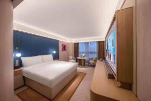 Postel nebo postele na pokoji v ubytování Lijia Hotel + 218 fotografií