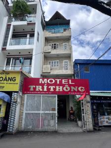 a building with a motelitution sign in front of it at Trí Thông Hotel in Ho Chi Minh City