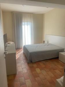 Postel nebo postele na pokoji v ubytování Bellavista Rooms