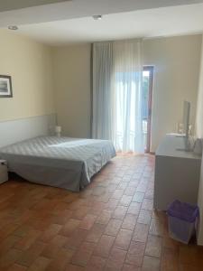 Postel nebo postele na pokoji v ubytování Bellavista Rooms
