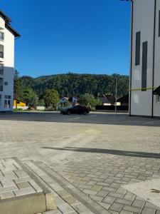 a parking lot with a car in the distance at N&D Arinis Studio in Gura Humorului