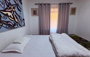 Letto o letti in una camera di DRAKON NEST HOMESTAY