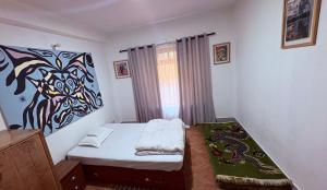 Letto o letti in una camera di DRAKON NEST HOMESTAY