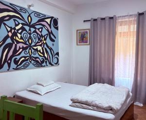 Letto o letti in una camera di DRAKON NEST HOMESTAY