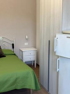 Postel nebo postele na pokoji v ubytování Fantasy House Ischia