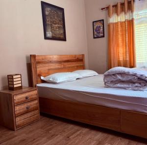 Letto o letti in una camera di DRAKON NEST HOMESTAY