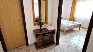 Postel nebo postele na pokoji v ubytování Apartman Merima