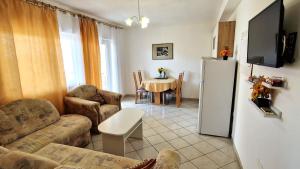 TV a/nebo společenská místnost v ubytování Apartman Merima