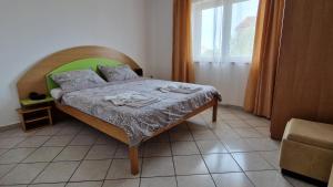 Postel nebo postele na pokoji v ubytování Apartman Merima