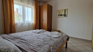 Postel nebo postele na pokoji v ubytování Apartman Merima