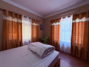 Letto o letti in una camera di DRAKON NEST HOMESTAY